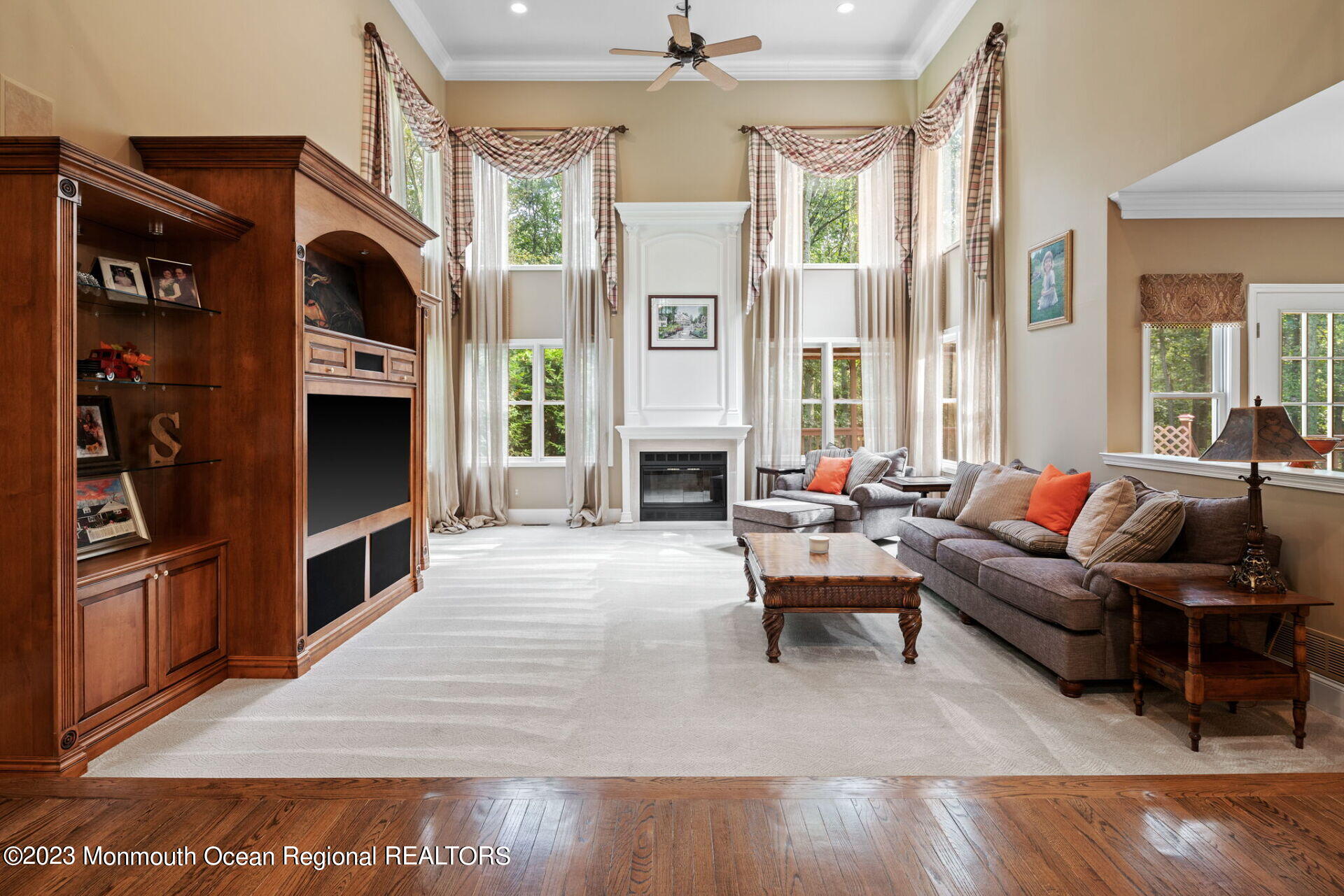 81 Agress Road Millstone Township, NJ 08535 - Photo 8 of 35 a living room with furniture a fireplace and a flat screen tv