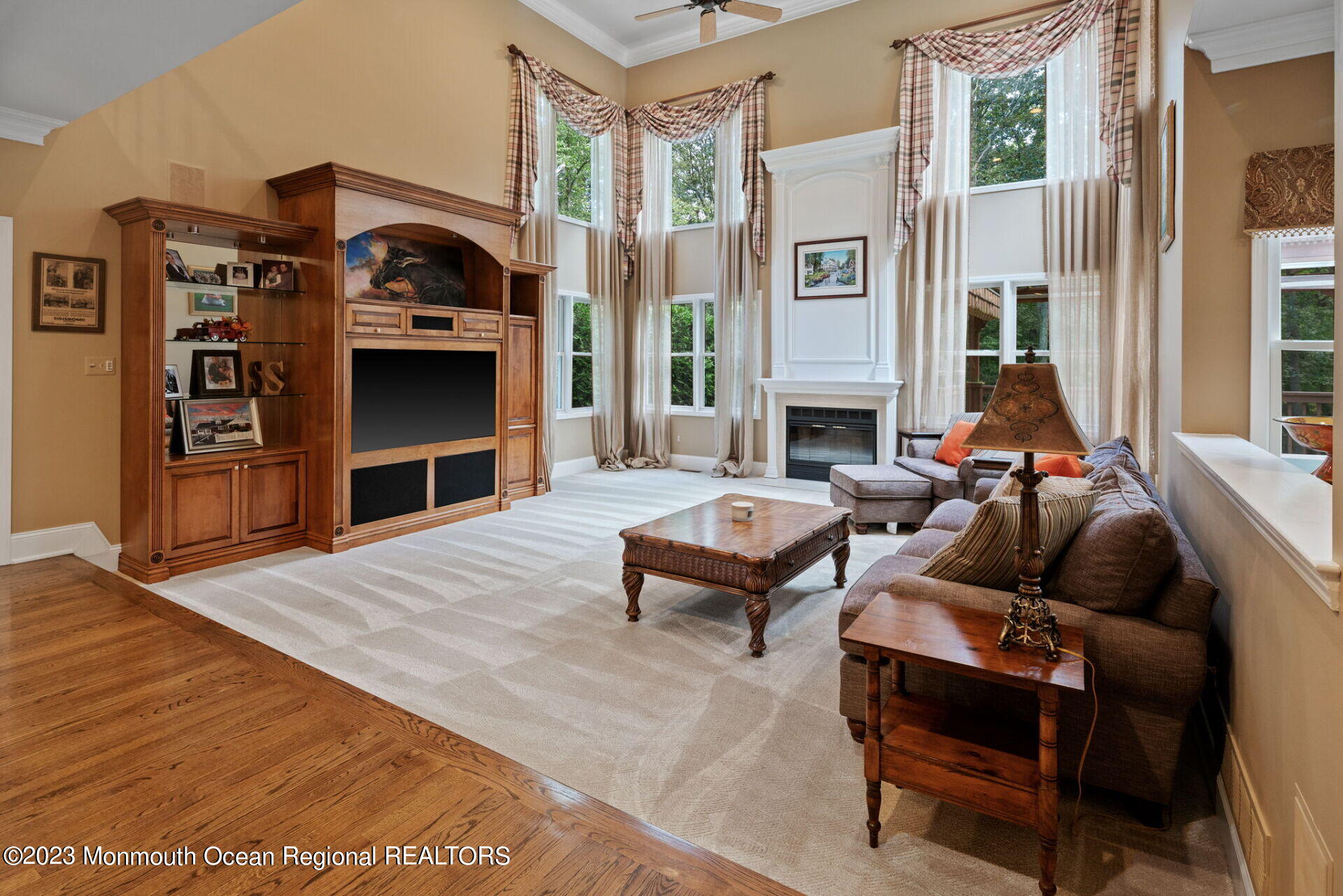 81 Agress Road Millstone Township, NJ 08535 - Photo 9 of 35 a living room with furniture and a fireplace