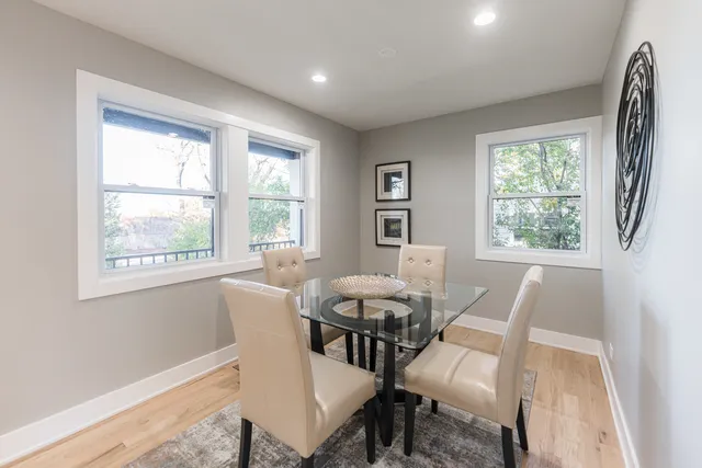 a view of a dining room with furniture window and outside view