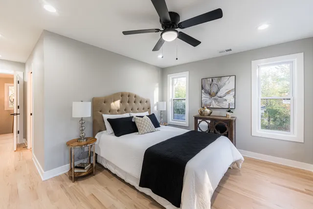 a bedroom with a large bed and a window