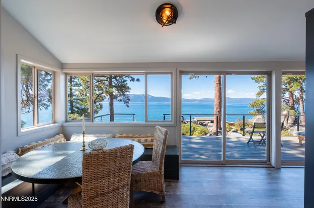 a view of living room with furniture and wooden floor