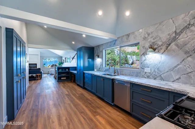 a view of a balcony with chairs and wooden floor