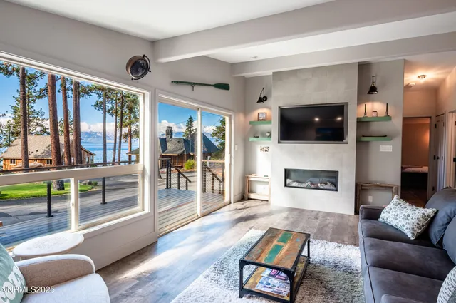 a kitchen with kitchen island granite countertop a sink counter top space appliances and cabinets