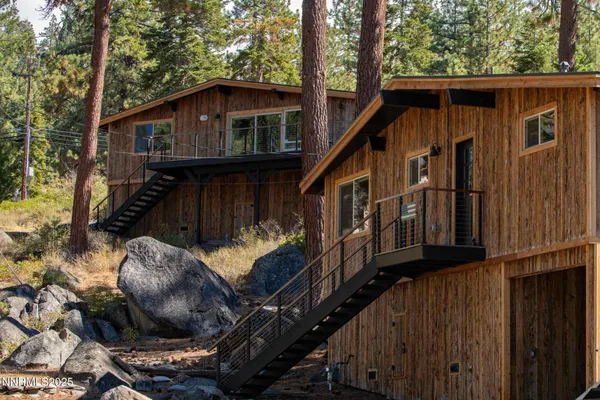 a living room with furniture a refrigerator and a table