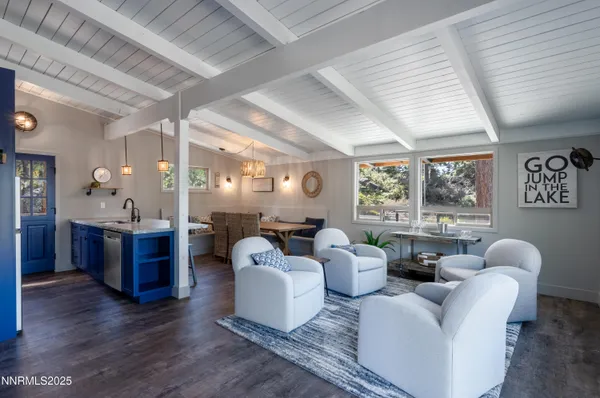 a living room with furniture and large windows