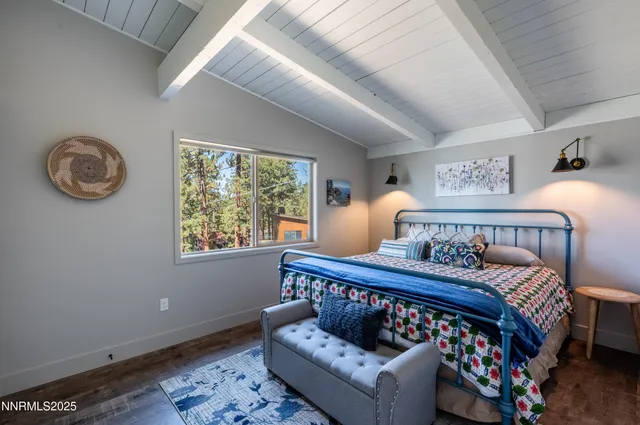 a bathroom with a granite countertop sink a toilet and mirror