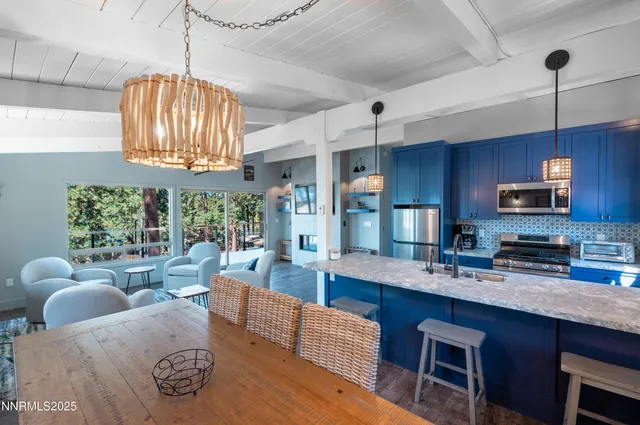 a view of a house with wooden fence next to a road