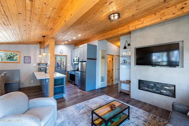 a bathroom with a granite countertop sink a toilet and mirror