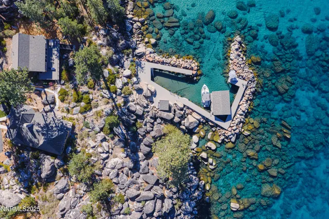an aerial view of a house with a ocean view