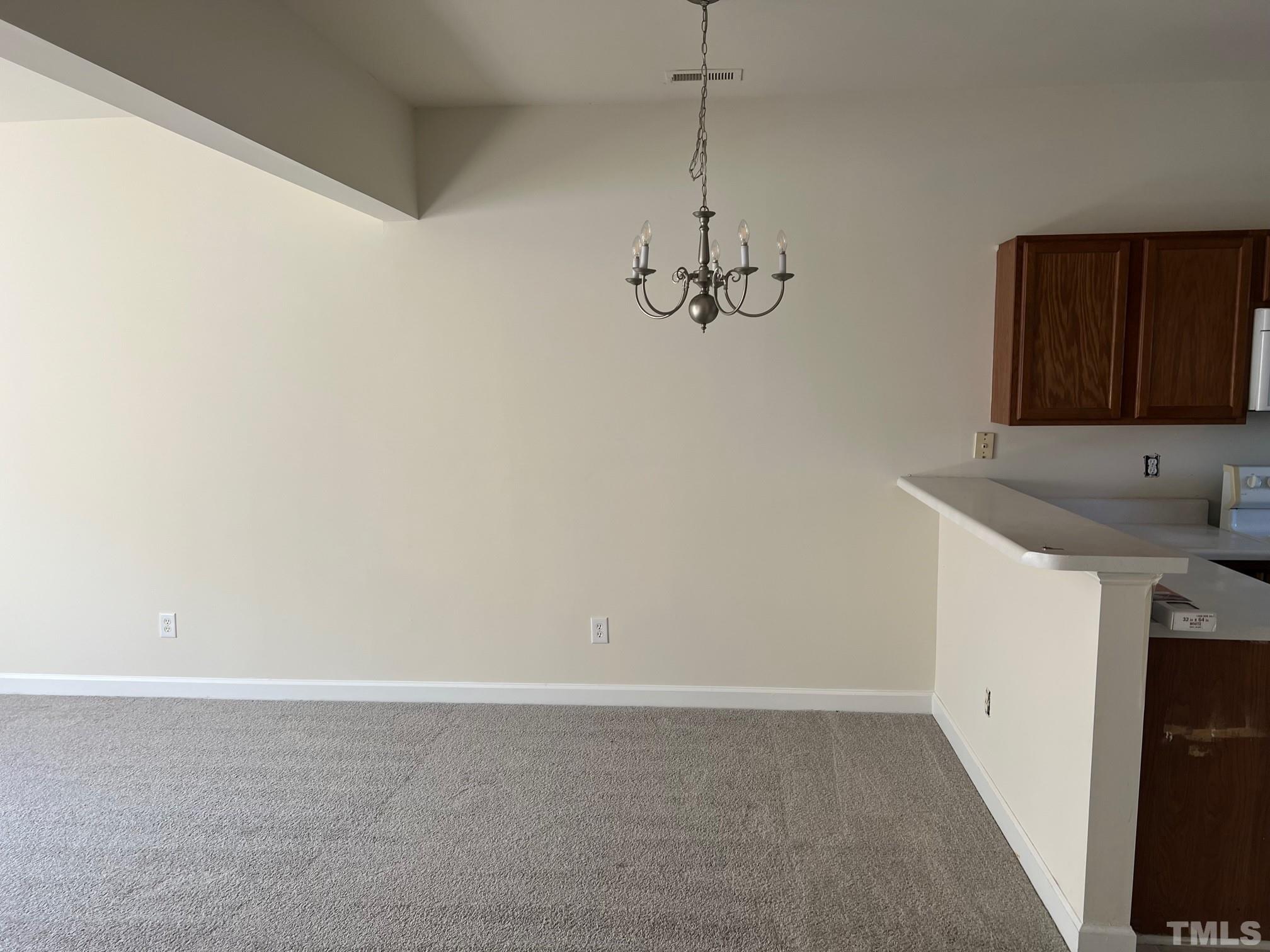 4644 Centrebrook Circle Raleigh, NC 27616 - Photo 6 of 11 a kitchen with a sink and cabinets
