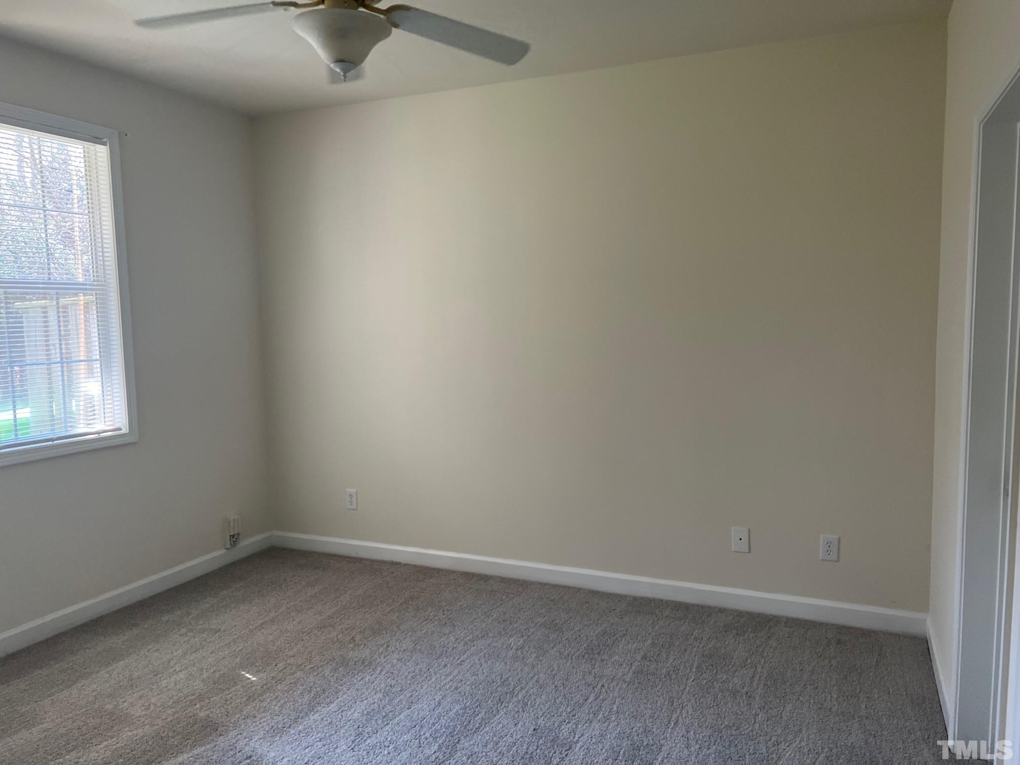 4644 Centrebrook Circle Raleigh, NC 27616 - Photo 8 of 11 an empty room with a window