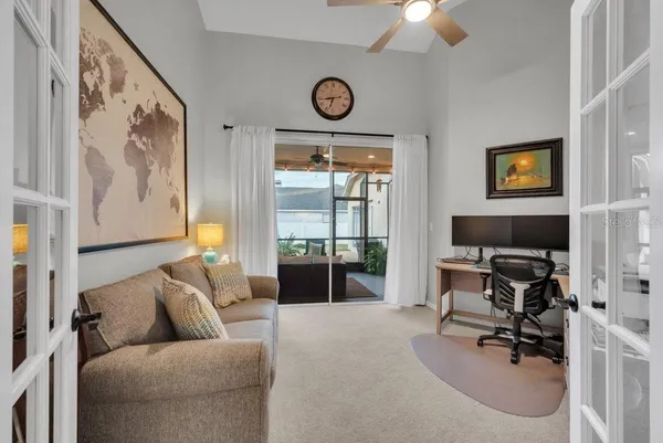a kitchen with stainless steel appliances granite countertop a stove top oven a sink a refrigerator and white cabinets
