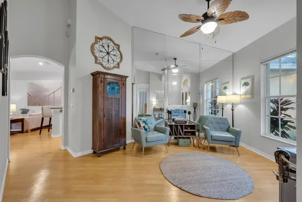 a kitchen with stainless steel appliances granite countertop a sink stove refrigerator and cabinets