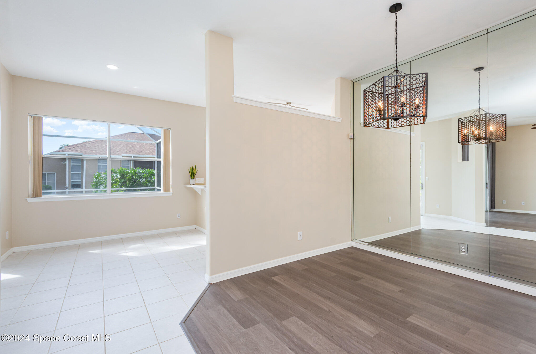 779 Thrasher Drive Rockledge, FL 32955 - Photo 14 of 35 a view of a room with wooden floor and window
