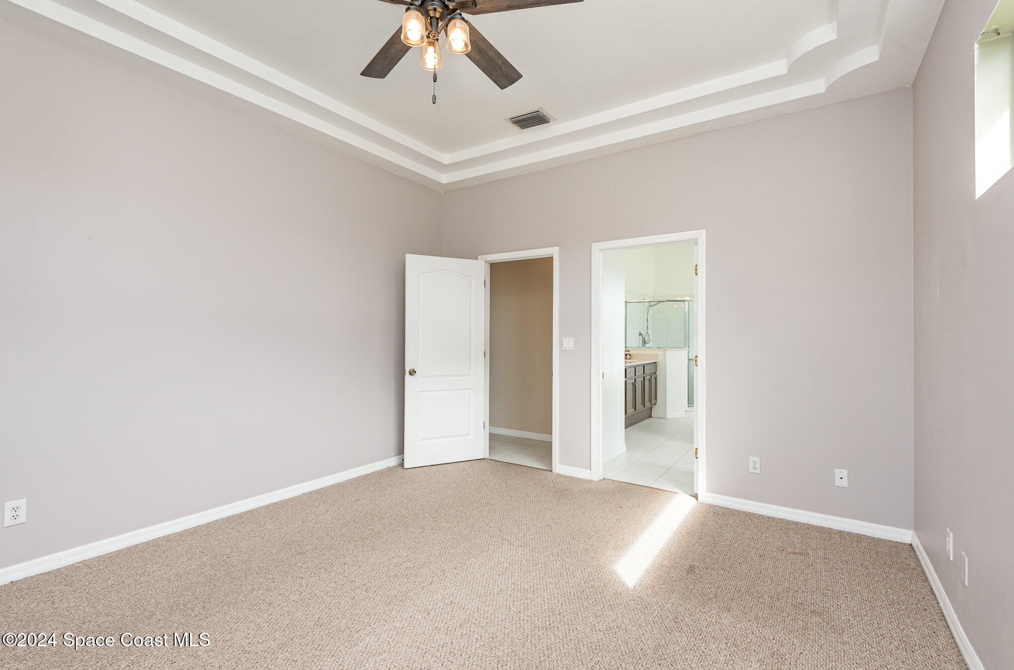 779 Thrasher Drive Rockledge, FL 32955 - Photo 20 of 35 a view of a big room with closet and chandelier fan