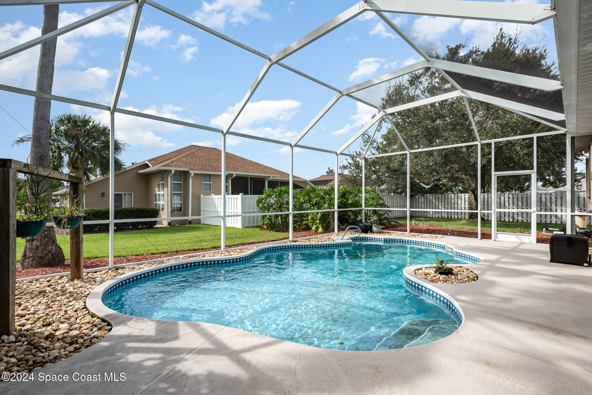 779 Thrasher Drive Rockledge, FL 32955 - Photo 2 of 35 a view of a house with swimming pool