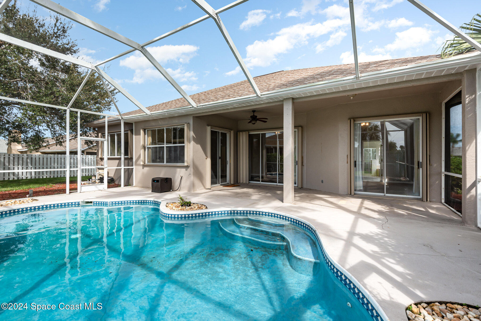 779 Thrasher Drive Rockledge, FL 32955 - Photo 29 of 35 a view of a house with pool and sitting area