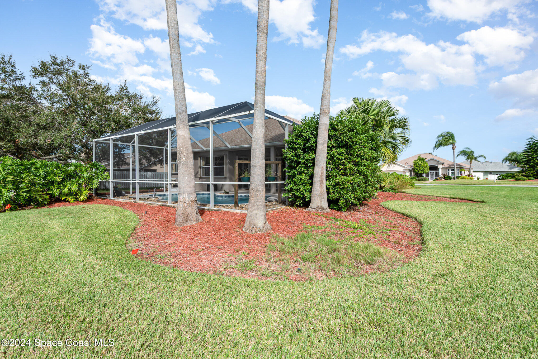 779 Thrasher Drive Rockledge, FL 32955 - Photo 32 of 35 a front view of a house with garden