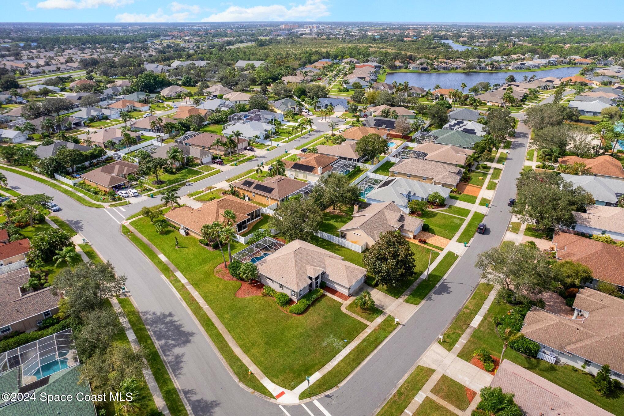 779 Thrasher Drive Rockledge, FL 32955 - Photo 34 of 35 an aerial view of residential houses with outdoor space