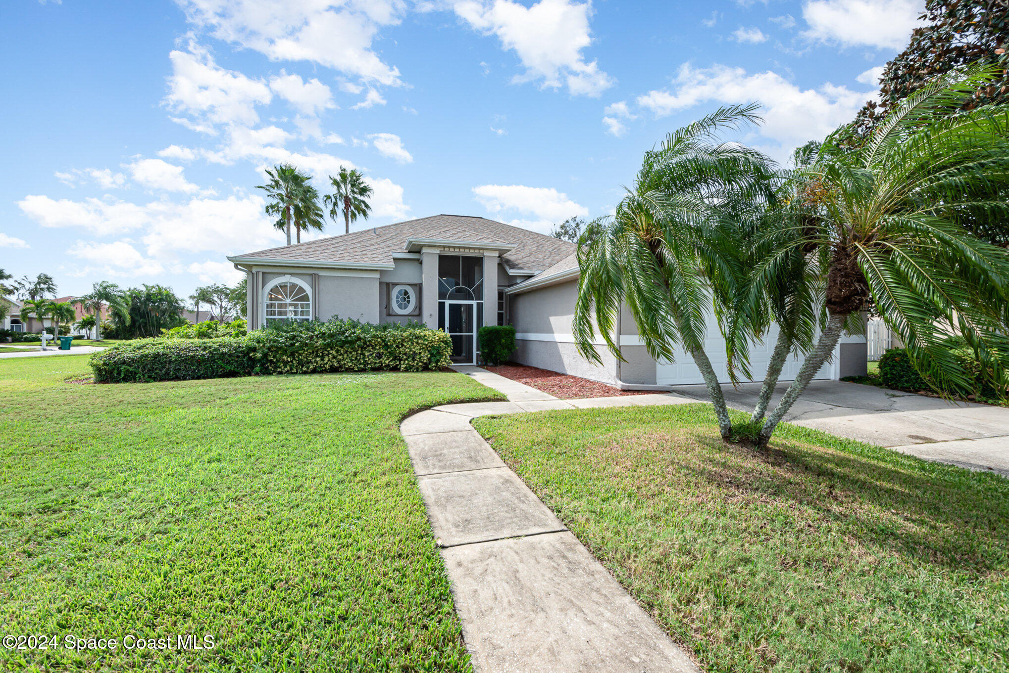 779 Thrasher Drive Rockledge, FL 32955 - Photo 7 of 35 a front view of a house with yard