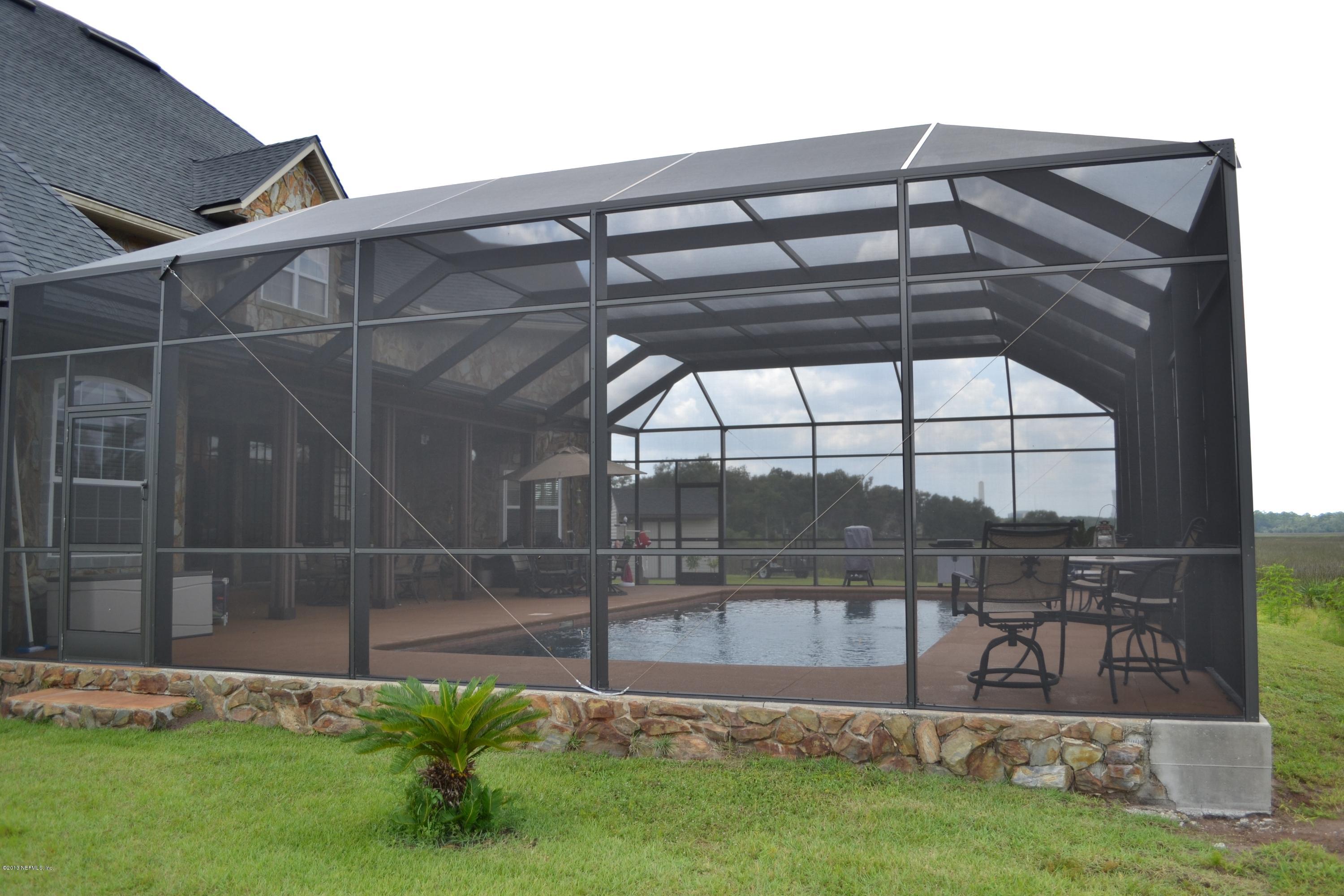 5900 Sheffield Road Jacksonville, FL 32226 - Photo 57 of 69 Exterior View of Screened in Pool Area 1