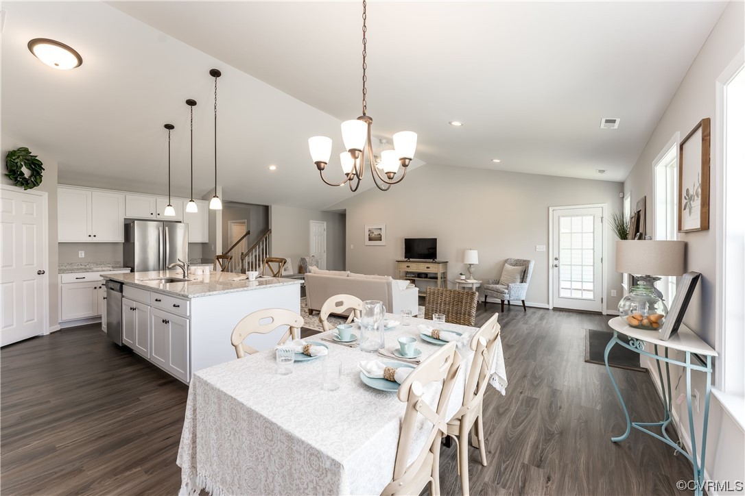 E5 Wendenburg Way, Unit E5 Aylett, VA 23009 - Photo 12 of 25 a very nice looking dining room with wooden floor