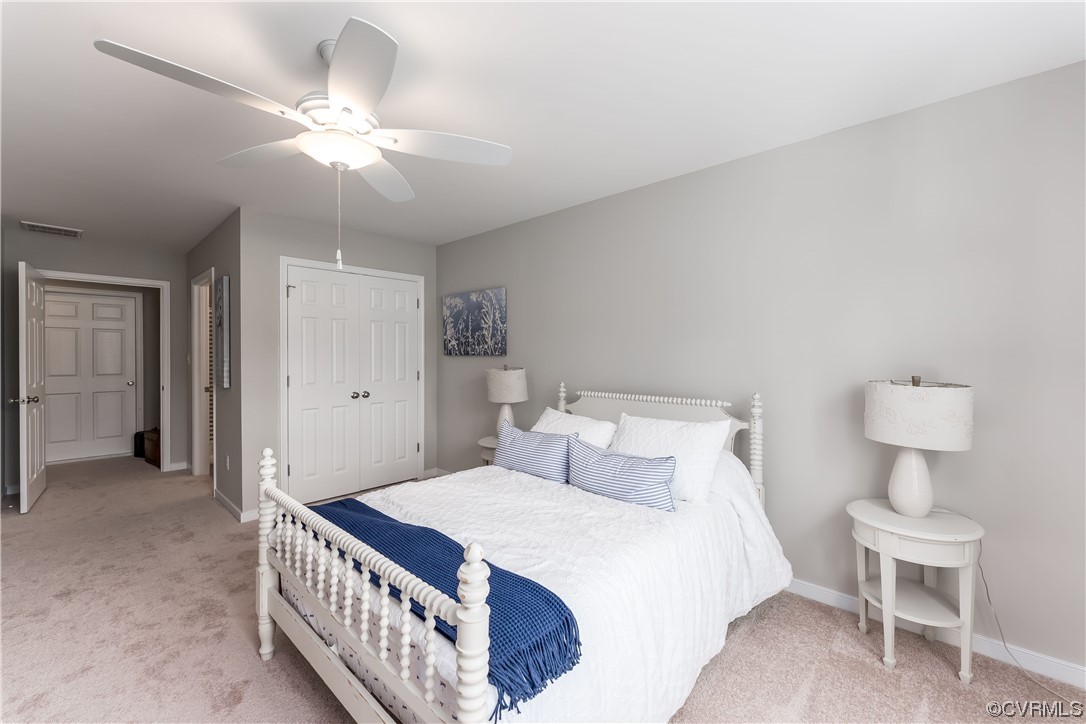 E5 Wendenburg Way, Unit E5 Aylett, VA 23009 - Photo 22 of 25 a bedroom with a bed and a chandelier