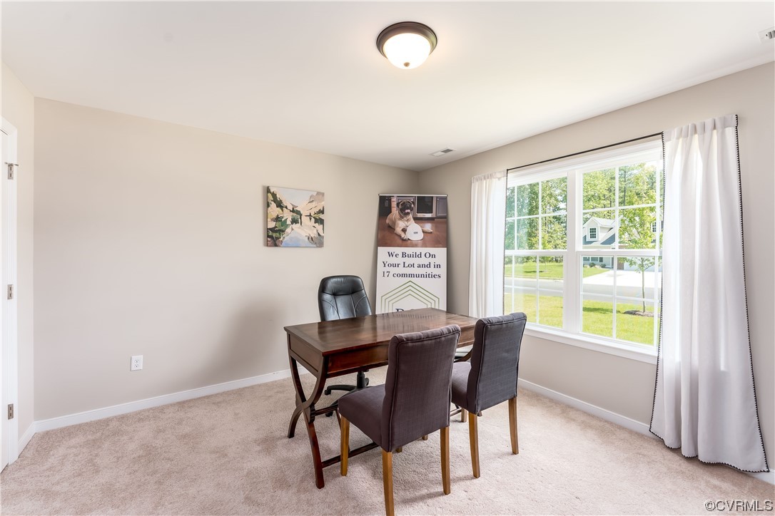 E5 Wendenburg Way, Unit E5 Aylett, VA 23009 - Photo 6 of 25 a view of a dining room with furniture a rug and a large window