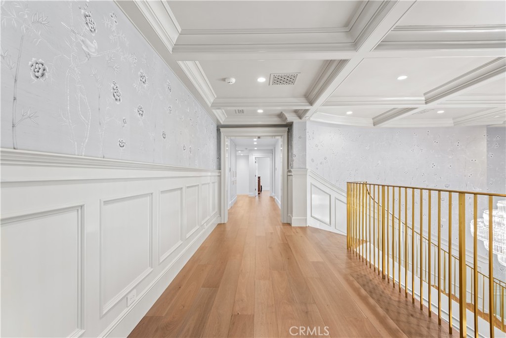 23924 Long Valley Road Hidden Hills, CA 91302 - Photo 18 of 39 a view of a hallway with wooden floor
