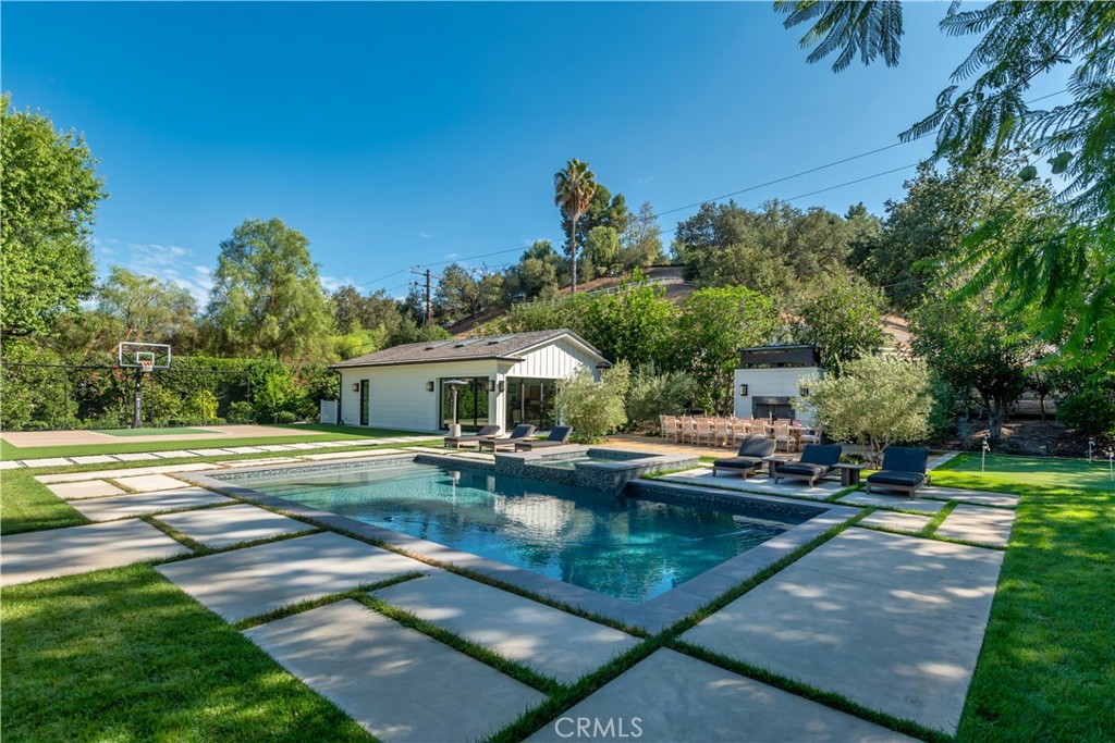 23924 Long Valley Road Hidden Hills, CA 91302 - Photo 31 of 39 a view of a house with pool and a yard