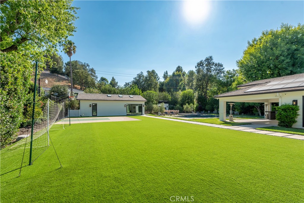 23924 Long Valley Road Hidden Hills, CA 91302 - Photo 33 of 39 a view of a house with a swimming pool