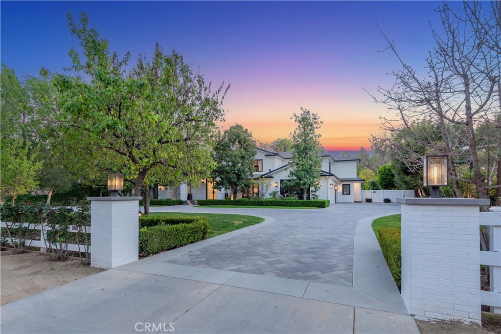 23924 Long Valley Road Hidden Hills, CA 91302 - Photo 37 of 39 a view of a backyard with couches plants and large trees