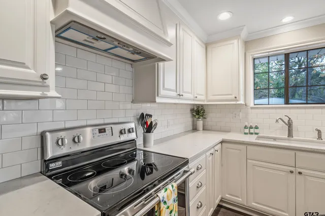 a kitchen with a stove and a sink