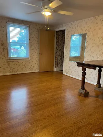 a kitchen with stainless steel appliances granite countertop a refrigerator and a stove