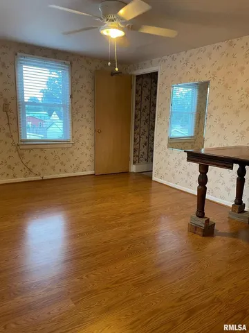 a kitchen with stainless steel appliances granite countertop a refrigerator and a stove