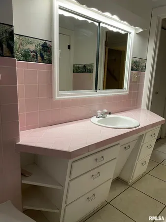 a bathroom with a toilet and a sink
