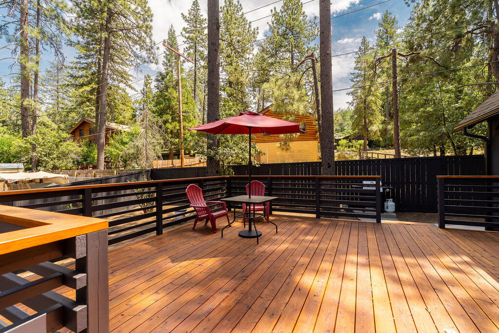 53589 Tollgate Road Idyllwild, CA 92549 - Photo 15 of 51 a view of a outdoor sitting area with chairs and wooden fence