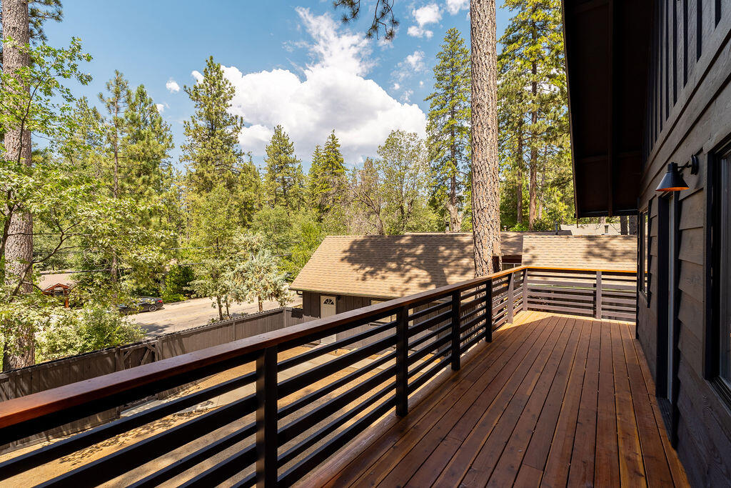 53589 Tollgate Road Idyllwild, CA 92549 - Photo 19 of 51 a view of a balcony with wooden floor and fence