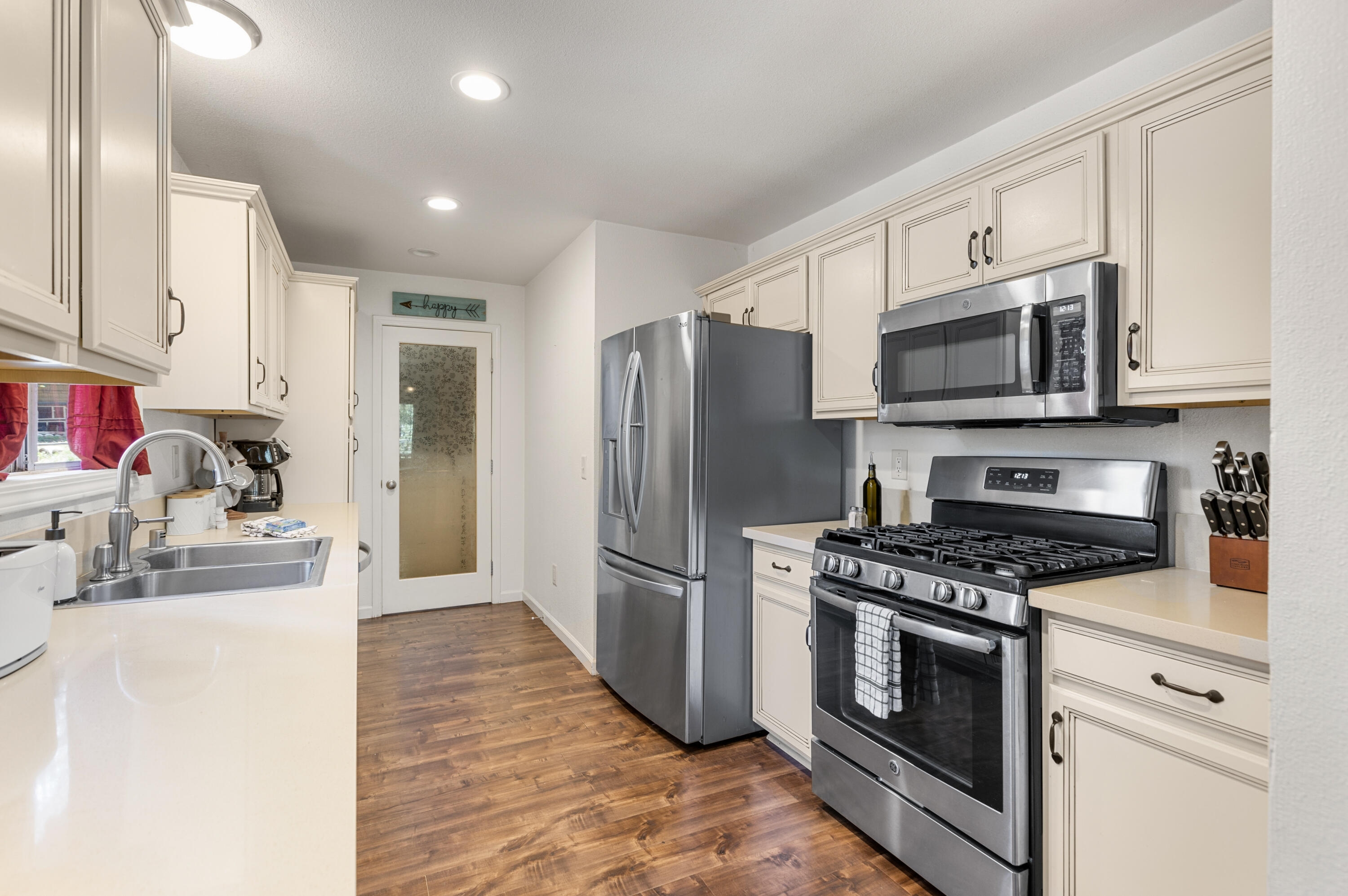 53589 Tollgate Road Idyllwild, CA 92549 - Photo 21 of 51 a kitchen with stainless steel appliances a stove a sink and a refrigerator