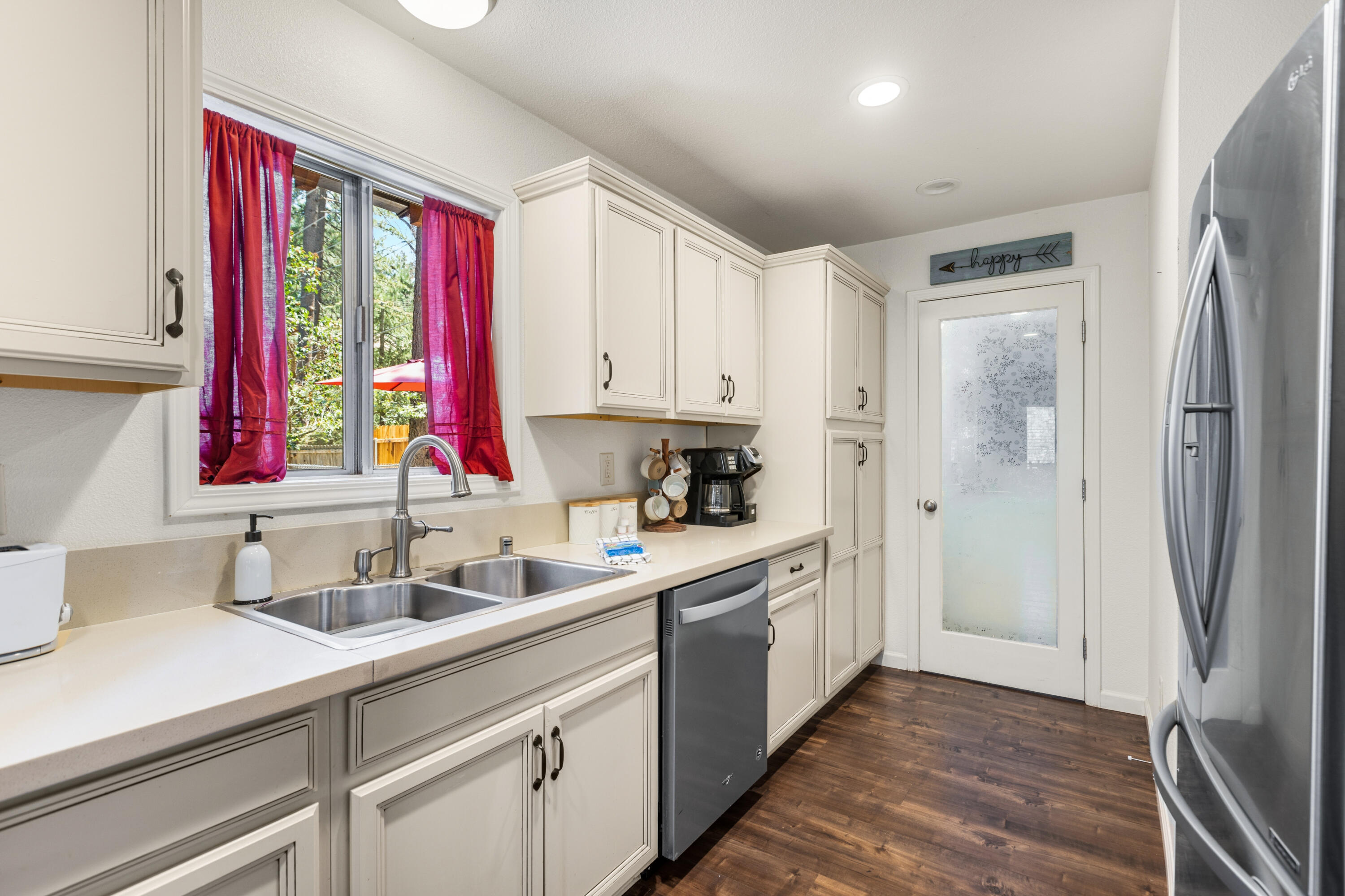 53589 Tollgate Road Idyllwild, CA 92549 - Photo 22 of 51 a kitchen with a sink window and cabinets
