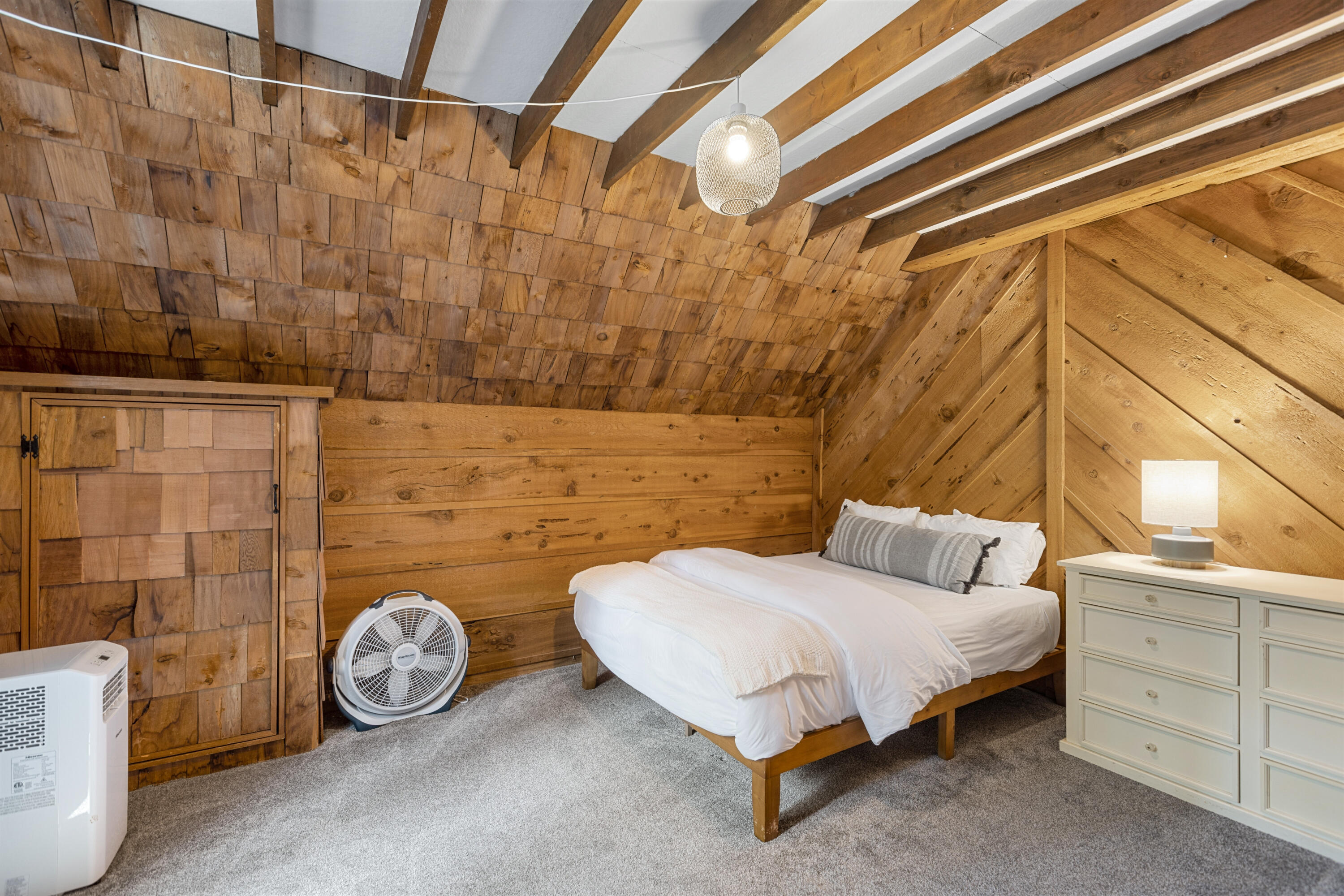 53589 Tollgate Road Idyllwild, CA 92549 - Photo 34 of 51 a bedroom with a bed and a wall painting