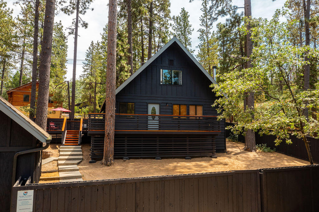 53589 Tollgate Road Idyllwild, CA 92549 - Photo 8 of 51 a view of house with wooden fence and trees in the background