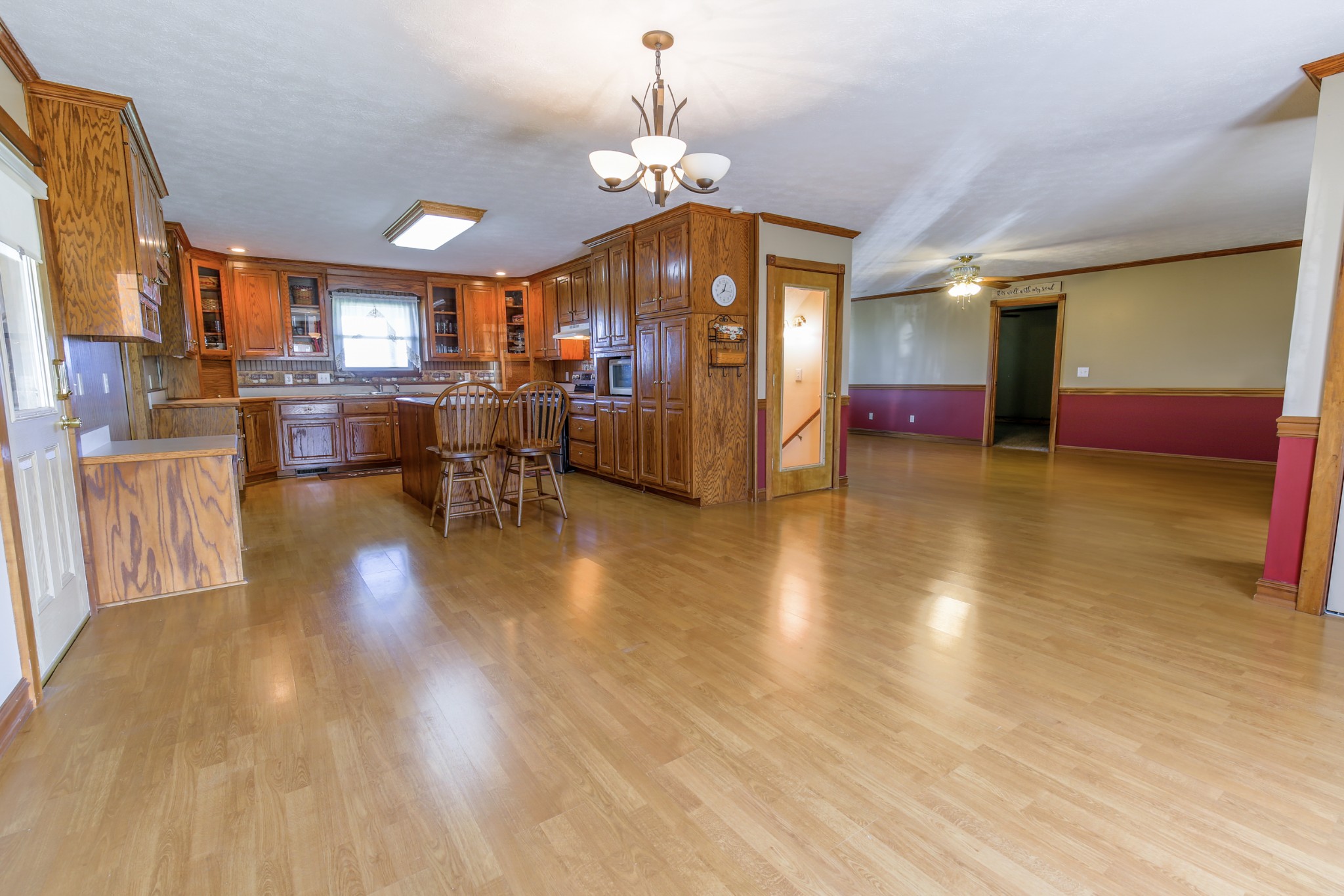 12 Camp Road Riddleton, TN 37151 - Photo 50 of 50 a view of a living room and kitchen with granite countertop wooden floor