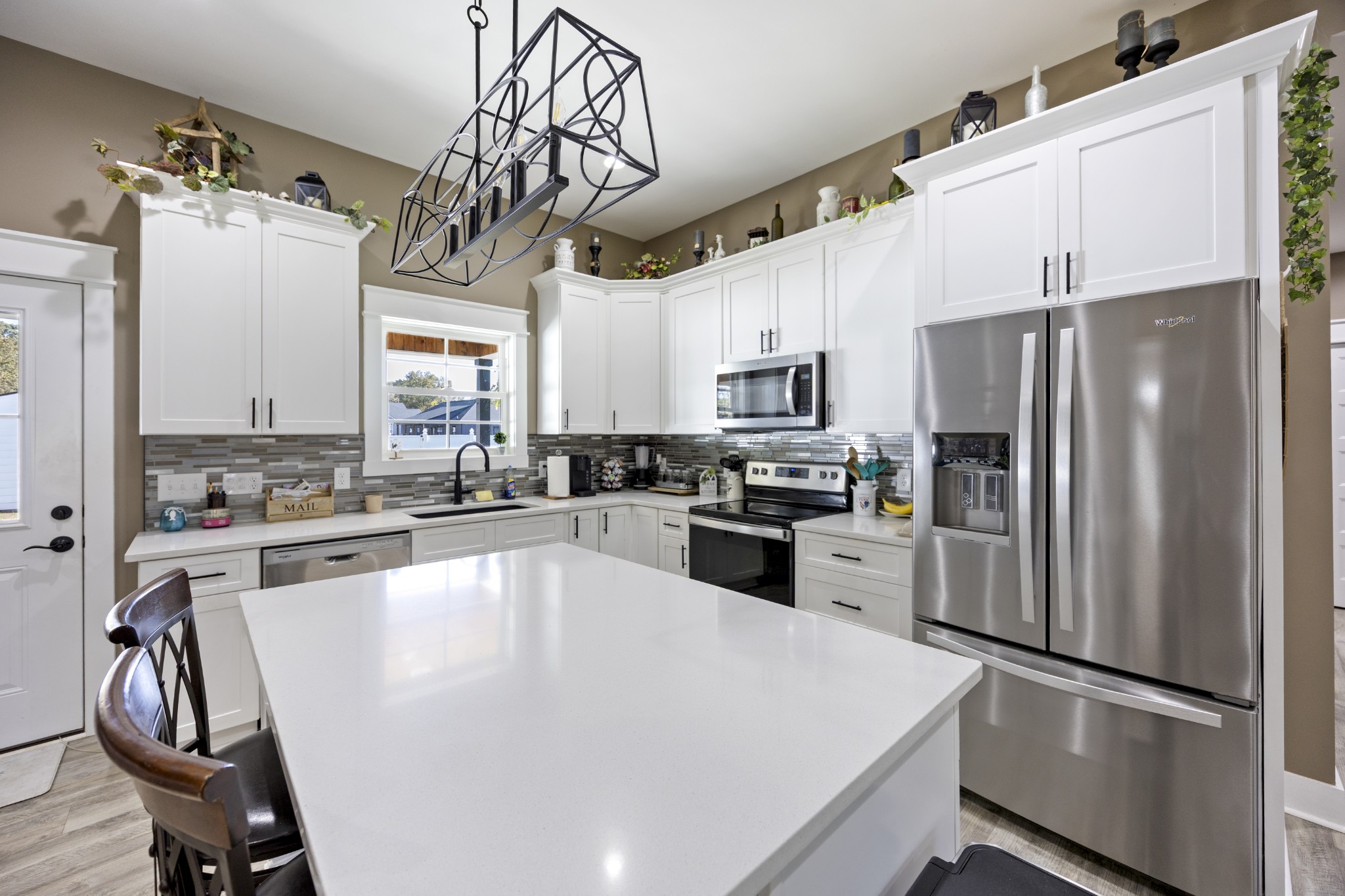 3575 Eastbrook Road Estill Springs, TN 37330 - Photo 6 of 36 a kitchen with a refrigerator a sink and cabinets