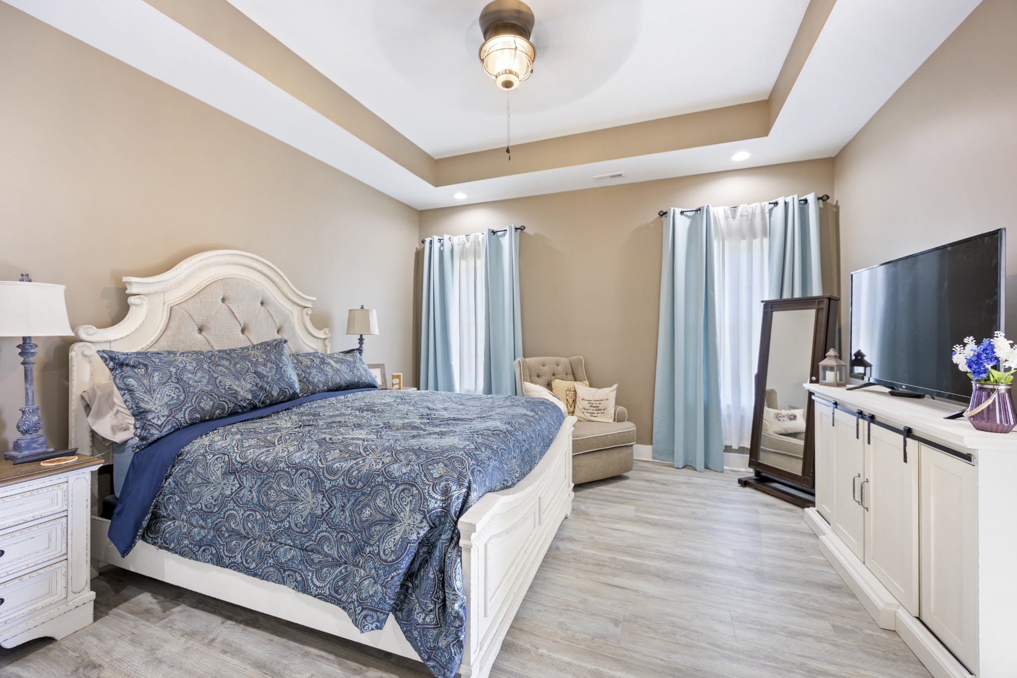 3575 Eastbrook Road Estill Springs, TN 37330 - Photo 8 of 36 a bedroom with a bed and a flat screen tv