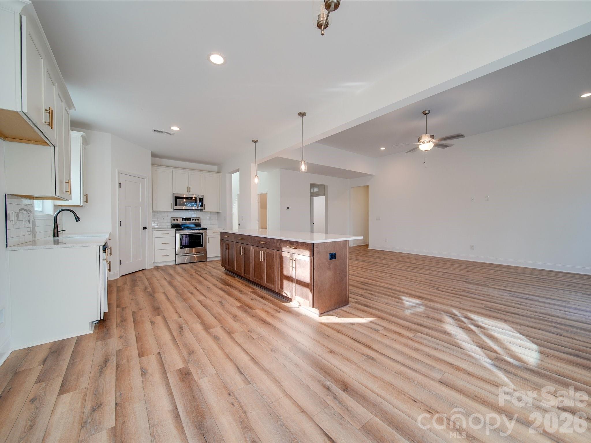 0 Hinson Road Monroe, NC 28112 - Photo 2 of 12 a view of kitchen with furniture and wooden floor
