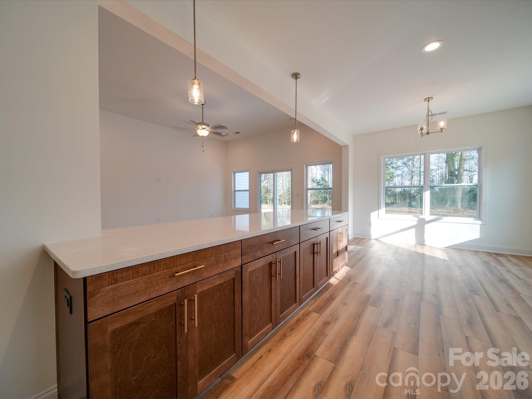 0 Hinson Road Monroe, NC 28112 - Photo 3 of 12 a large kitchen with kitchen island wooden floors and stainless steel appliances