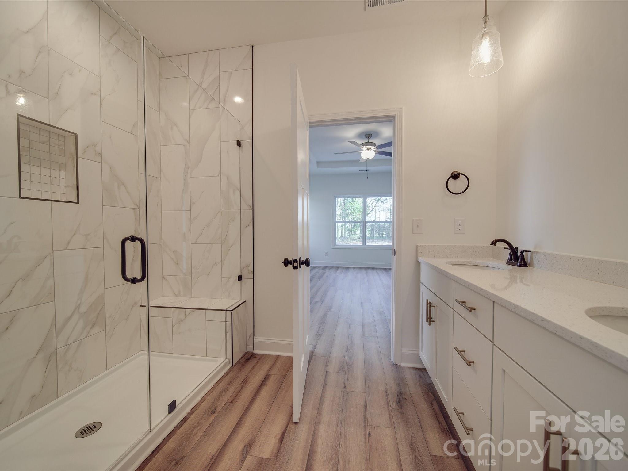0 Hinson Road Monroe, NC 28112 - Photo 5 of 12 a bathroom with a double vanity sink a toilet and shower