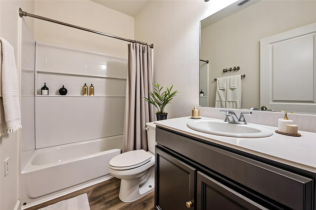 801 Peach Tree Lane Anna, TX 75409 - Photo 11 of 14 a bathroom with a sink a toilet and shower