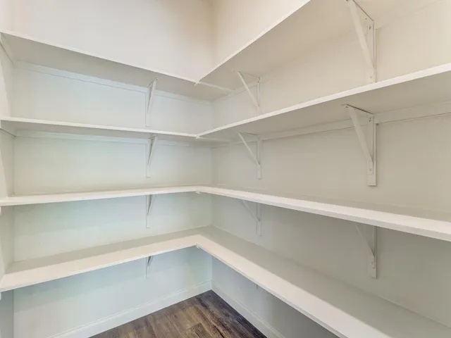 a view of an empty walk in closet
